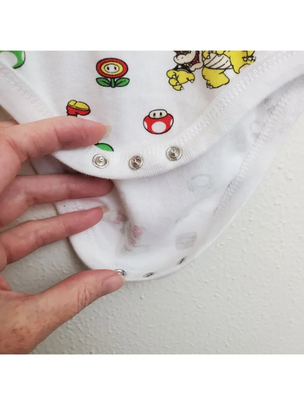 Super Mario Nintendo all-over-print baby onesie